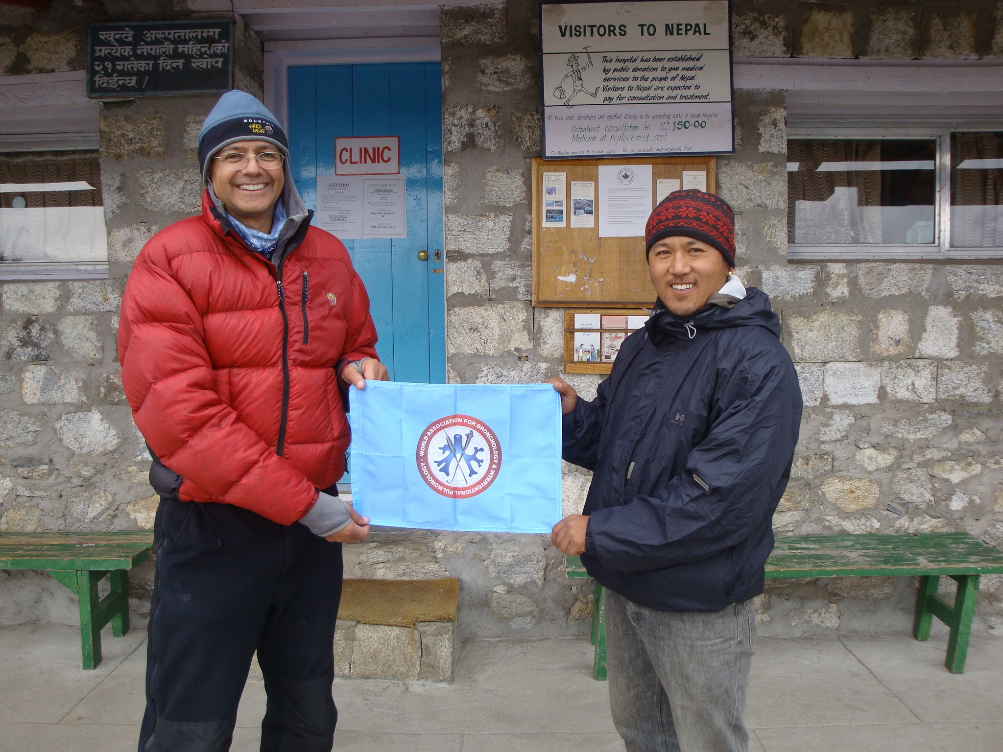 Henri Colt and a colleague outside a mountain clinic in Nepal